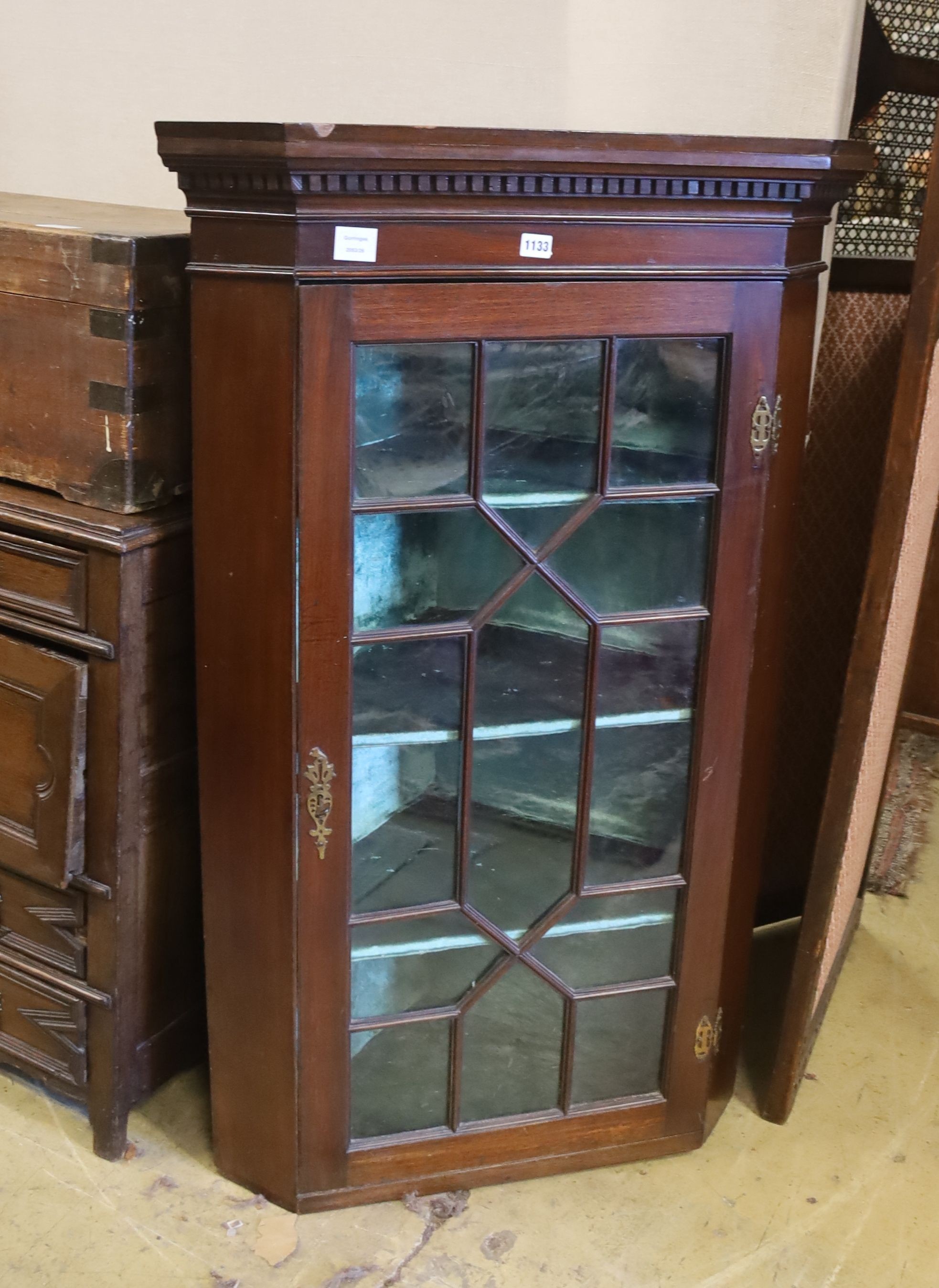 A George III and later mahogany astragal glazed hanging corner cabinet, width 77cm, depth 50cm, height 126cm